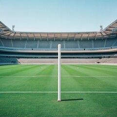 Obraz premium Empty Football Stadium with Single Goal Post on Green Field