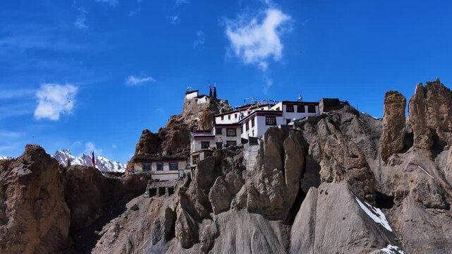 Aerial drone shot displaying the mystical charm of Dhankar Monastery in winter, its ancient walls standing resilient against the cold Himalayan winds.