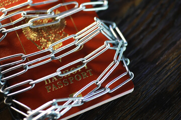 Secured Passport Enclosed in Chains - Symbol of International Travel Restrictions and Identity...