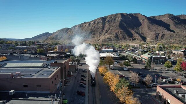 Durango Colorado Steam Train Rolling Through Town During Autumn