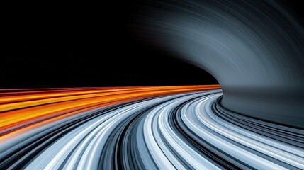 Speed and Motion Blur in Tunnel: Abstract image of fast car driving through a dark tunnel. Light trails create dynamic streaks of color against the dark background, suggesting speed and motion. 