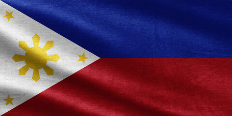 Philippines flag with textile texture, white triangle with golden sun and stars, blue and red stripes.