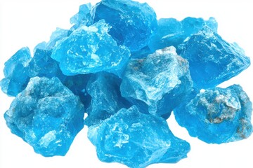 Bright blue crystals scattered together on white background, showcasing their vibrant color and irregular shapes, perfect for decorative or educational purposes.