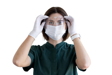 close up portrait of woman in medical uniform,mask and medical face shield on transparent background, woman in green uniform and gloves looking at camera. medicine, healthcare. professional occupation