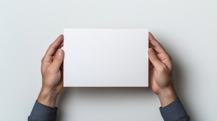 Obraz premium Blank Papercard Hands Minimalist Style High-resolution Flat Lighting Overhead Flat Lay Presentation Neutral Background Clean Bright Tones Perfect Mockup Designs