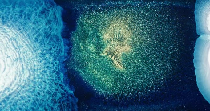 Microscopic view of chemical reaction creating abstract art with alcohol ink drops and particles generating a mesmerizing flow of colors and textures, perfect for live wallpapers, in blue green white