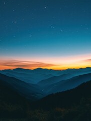 Fototapeta premium Majestic mountain range silhouette under a vibrant twilight sky filled with twinkling stars scenic vista