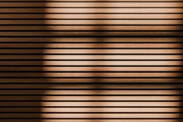 Vertical wooden acoustic panel hit by daylight. Black acoustic foam in the back of the panel.