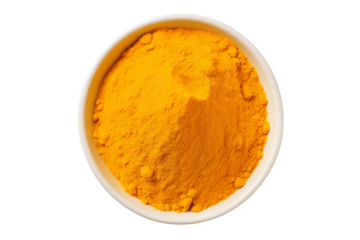 A top down shot of bright yellow turmeric powder in a white bowl against a on transparent background