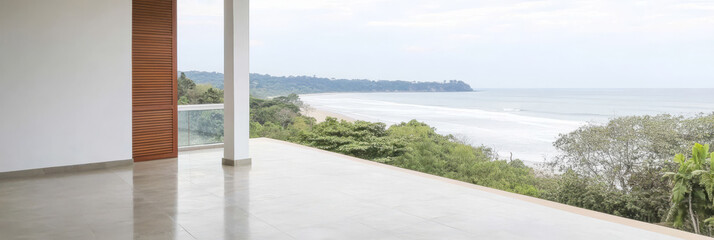 Coastal view from open terrace overlooking sandy beach and ocean waves