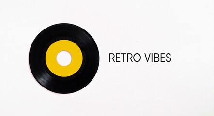 Vinyl record with yellow label spreading retro vibes