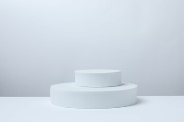 White podiums on a light background