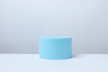 Blue podium on a light background