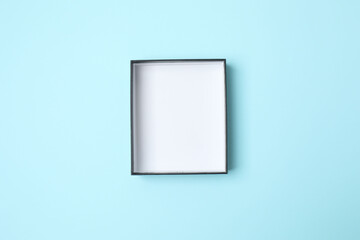 Open cardboard box on blue background