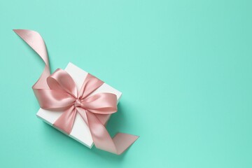 Beautiful gift box on color background