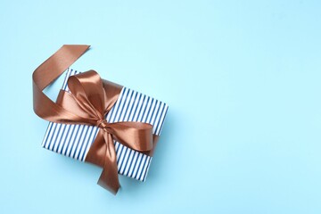 Beautiful gift box on color background