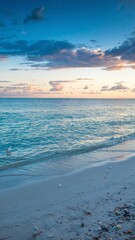 Fototapeta premium A stunning sea view with a sandy shore, showcasing a vibrant landscape with vivid colors. Tranquil waves meet golden sands under a breathtaking sky, perfect for travel and nature themes. 