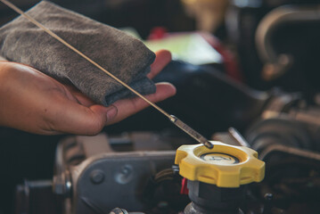 Close up Man hands fixing Car machinery vehicle mechanical service. Mechanic man hands repairing...