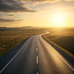 Fototapeta premium Winding road vanishing into a bright, distant horizon
