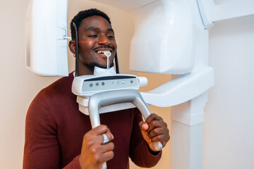 Patient undergoing dental x ray scan in modern clinic
