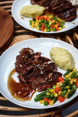 A Homemade Beef Steak looks intact, accompanied by some sauce on the side. It is very delicious and appetizing. Selective focus.