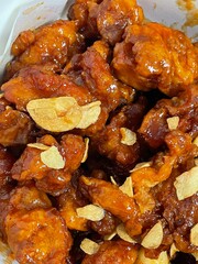 Crispy Korean fried chicken, perfectly glazed with a sweet and spicy sauce. Ideal for food photography and menus, showcasing the irresistible crunch and flavor of this beloved dish.

