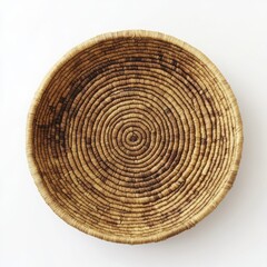 Naklejka premium Handmade circular basket with intricate woven pattern isolated on white background