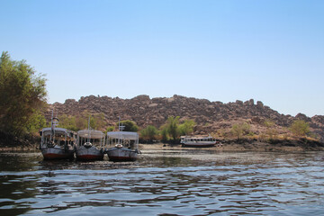 Fototapeta premium Motorboat to travel across the River Nile to Philae Temple, Aswan, Egypt