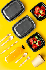 Tomatoes salad in plastic delivery tray, top view. Catering concept