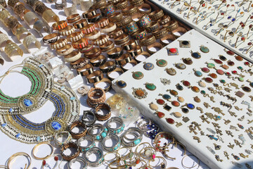 Traditional Egyptian accessories display on the white cloth for sales in Aswan, Egypt