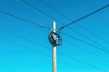 Landline telephone cable and wooden post