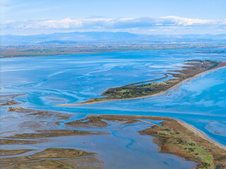 Aerial view of archipelago and a St. Andrea Island in Mariano lagoon, Italy