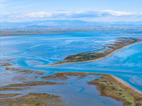 Aerial view of archipelago and a St. Andrea Island in Mariano lagoon, Italy