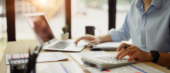 Businessman calculating finances at office desk. Concepts of finance management
