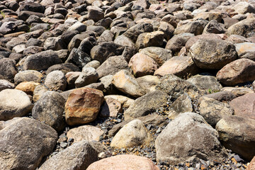 Large boulders in the sun as background