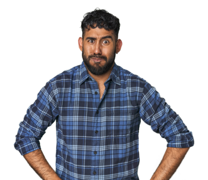 Young Hispanic man isolated blows cheeks, has tired expression. Facial expression concept.