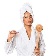 Young Filipino woman in bathrobe feels proud and self confident, example to follow.
