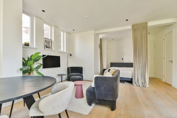 A serene and stylish interior featuring a living space with a cozy theme, plants, and minimalist furniture that promotes relaxation and comfort.