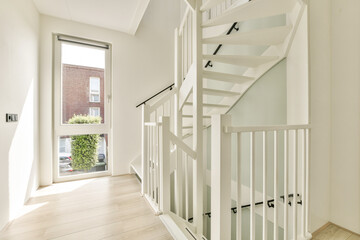 A bright, contemporary staircase in a well-lit interior featuring a sleek design and minimalist aesthetic. Perfect for showcasing modern architecture.
