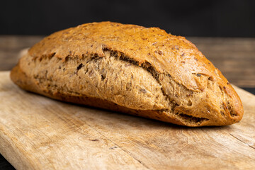 a healthy loaf of soft bread with added seeds and bran