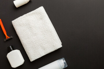 shaving man set. shaving machine, towel, lotion and shaving foam on colored background. Men bath Accessories top view