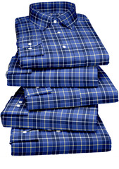 A folded stack of blue cotton clothes includes casual jeans and a shirt, an isolated garment object