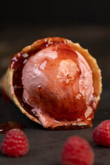 icecream with red raspberry berries and fresh jam , berry flavored ice cream with fresh raspberries and blackberries