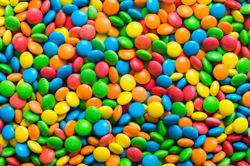 colorful candies as background top view. Seamless pattern with candy. Many sweet candies close-up