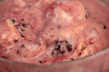 cold natural ice cream with different flavors , ice cream in a glass container, cold natural ice cream