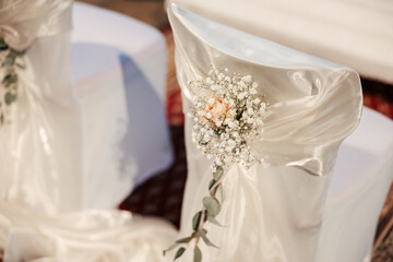 Gracefully adorned with ribbons and blooms, the church whispers elegance. Each detail adds a touch of romance to the sacred space where vows will soon be exchanged.