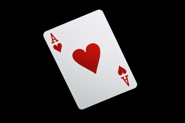Obraz premium A single Ace of Hearts card isolated on a solid black background, offering a dramatic and simple design for card-related content.