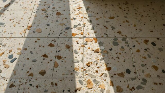 Natural terrazzo surface featuring a blend of stone fragments and subtle textures, ideal for design and architectural applications. Perfect for interiors, flooring, or artistic