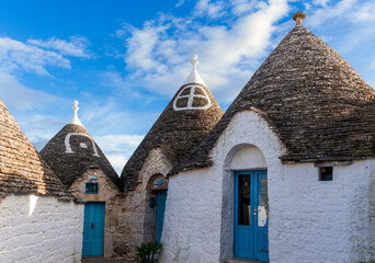 wonderful white mediterranean architecture of italian buildings with sdtrange conic roofs and wfite...