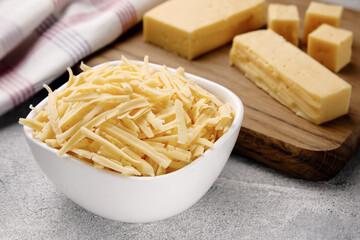 Heap of grated delicious cheese. Concept: Italian cuisine, cheese, restaurant, and food.